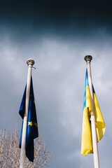 The flag of the European Union and Ukraine flutter in the wind