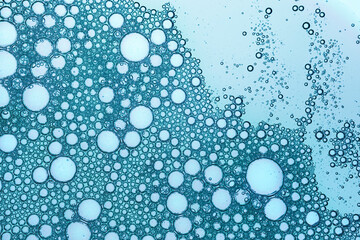 Cosmetic blue water gel splash with bubbles texture background