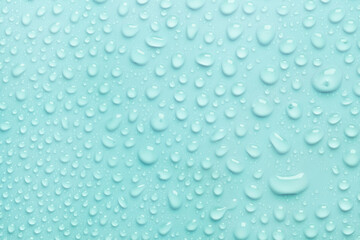 Cosmetic moisturizing liquid drops on green blue background. Toner or lotion. Hyaluronic serum	