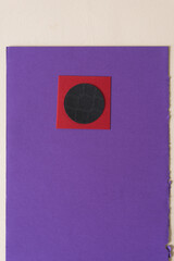 black paper sphere on square and purple paper