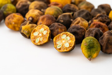 Dried small limes on a white background
