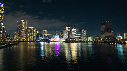 Fototapeta na wymiar Night view of a high-rise condominium along an urban river_31