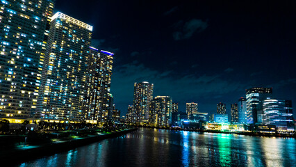 Fototapeta na wymiar Night view of a high-rise condominium along an urban river_33