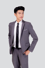Portrait young asian businessman in suit with confident and friendly isolated on white background, business man smart with success hand in pocket, manager or executive with handsome and leadership.