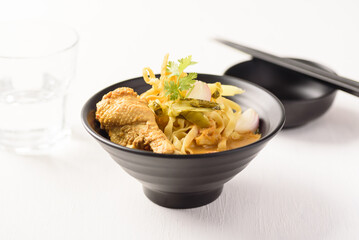 Khao Soi, Northern Thai food noodle red curry soup with coconut milk and chicken