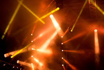 Spot lights on the stage during night concert in summer - obrazy, fototapety, plakaty