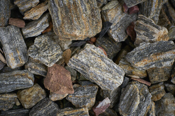 Rock pieces crushed gravel texture. Crushed stone texture background. Macadam. Stone texture