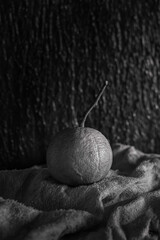Orange fruit, black and white photo with background, natural light