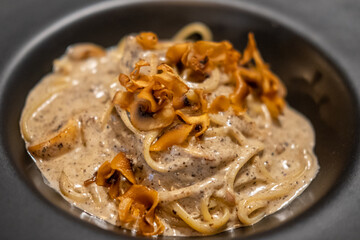 Black truffle spaghetti served on plate