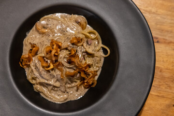 Black truffle spaghetti served on plate