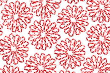 Christmas or candy design pattern of artfully arranged candy canes in a circular or medallion pattern