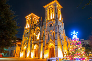 San Fernando Cathedral at 115 Main Plaza (Plaza Mayor) at night with neon light in downtown San Antonio, Texas TX, USA. 