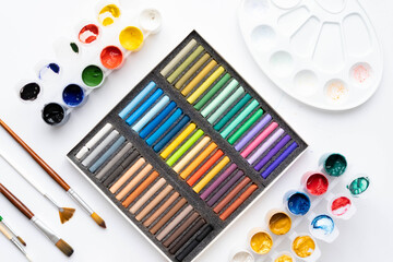 Naklejka premium Flat composition set of artistic tools. Brushes, paints, pencils, pastels for drawing. Place for text.