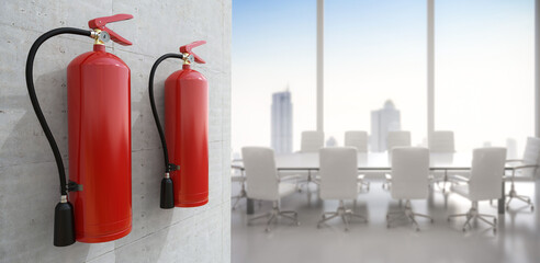 Fire extinguishers hanging on wall in office