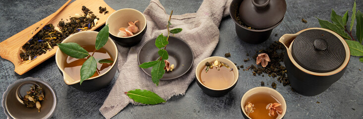 Asian tea set on dark background.