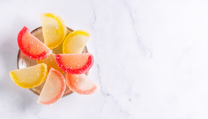 Traditional candy . Traditional candy, colorful agar slices in the form of a orange wedge.