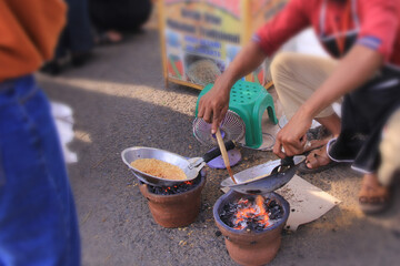 selective focus, our seller provides Kerak Telor or sticky rice omelet is a traditional Betawi food...