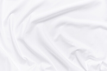 Fototapeta na wymiar White fabric texture background. Cloth soft wave. Creases of satin, silk, and cotton.