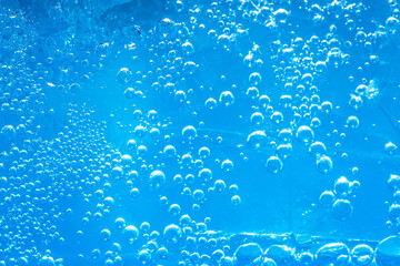 Blue macro bubbles,Colorful artistic of oil drop floating on the water. 