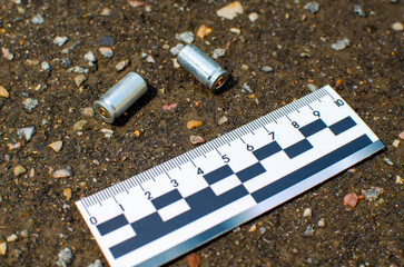 pistol case at the crime scene. forensic ruler