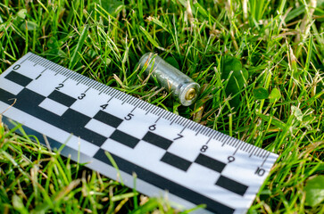 pistol case at the crime scene. forensic ruler