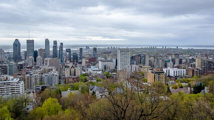 Panoramic view of the city center of Montreal from the Mount Royal (Mont Royal), a large intrusive rock hill or small mountain, west of Downtown Montreal in the province of Quebec, Canada