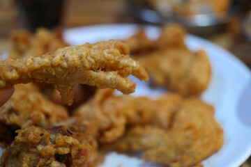 It is a golden fried chicken feet dish.