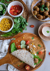 Home cooked Middle Eastern meal. Falafel Wrap with Tahini Sauce. Delicious and healthy food for light eater and weight watcher