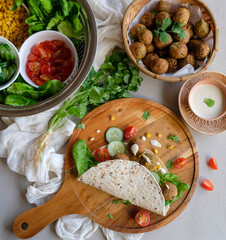 Home cooked Middle Eastern meal. Falafel Wrap with Tahini Sauce. Delicious and healthy food for light eater and weight watcher