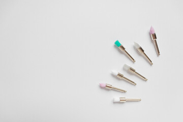 Metal nozzles with multicolored brushes for professional teeth cleaning of dogs and cats. Isolated on white background.