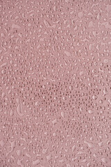 Drops splatter pattern on neutral pink background. Minimalist beauty template