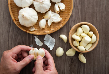 Fototapeta na wymiar Fresh garlic on wooden table