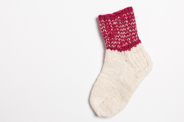 Obraz na płótnie Canvas knitted wool socks on a white background