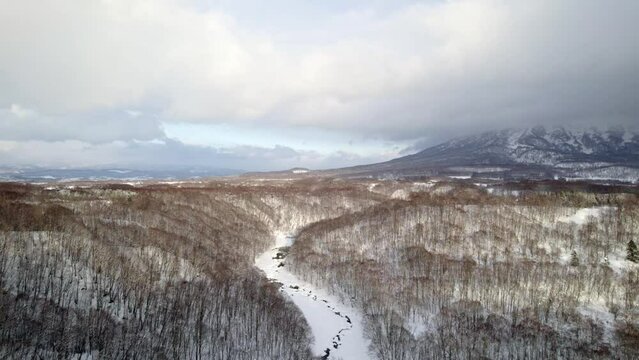 Snowy, Cloudy day over nature in Hokkaido, Japan with Mount Yotei in the Background