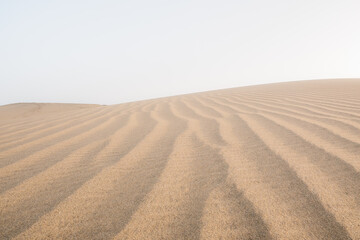 Girl exploring some sand dunes