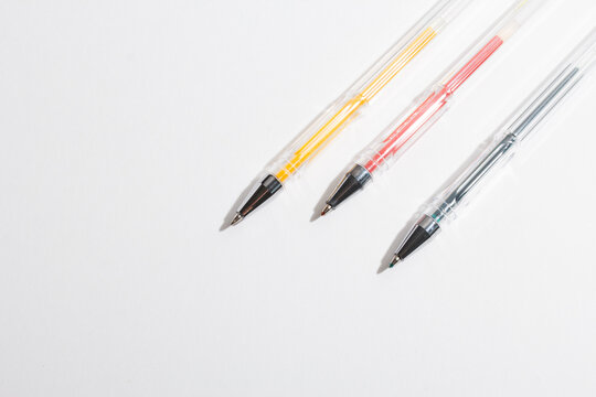 colored gel pens for writing on a white background