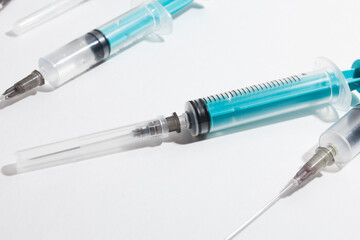 Medical syringe on a white background. A syringe for injection. The concept of health and beauty