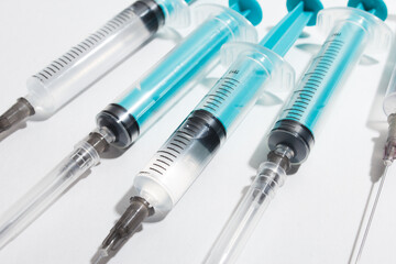 Medical syringe on a white background. A syringe for injection. The concept of health and beauty