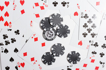 playing cards and poker chips on a white background