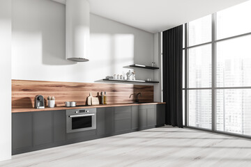 Bright kitchen room interior with panoramic window, oak wooden floor