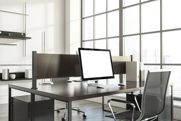 Corner view on bright office interior with desk with desktop