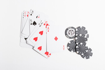 playing cards and poker chips on a white background