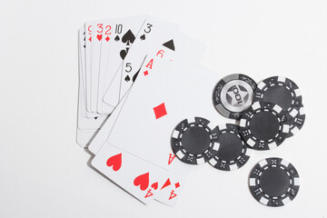 playing cards and poker chips on a white background
