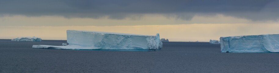 Fototapeta na wymiar Huge tabular icebergs on the waters off the Antarctic Peninsula, Brown Bluff, Antarctica