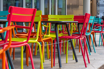 colorful chairs in front of a closed restaurant