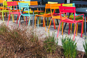 colorful chairs in front of a closed restaurant