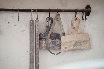 Used dirty pottery instruments stored on heavy-duty magnetic tool holder - obrazy, fototapety, plakaty