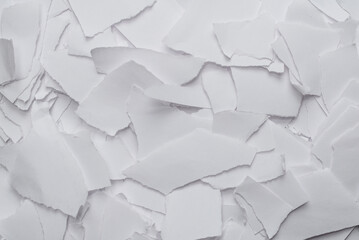 Empty white paper pieces as a background.