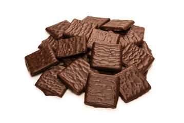 Dark chocolate candies isolated on white background.