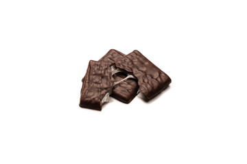Dark chocolate candies isolated on white background.